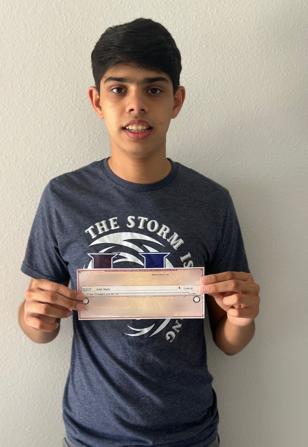 Ankit Hegde holding IT Scholarship Award check