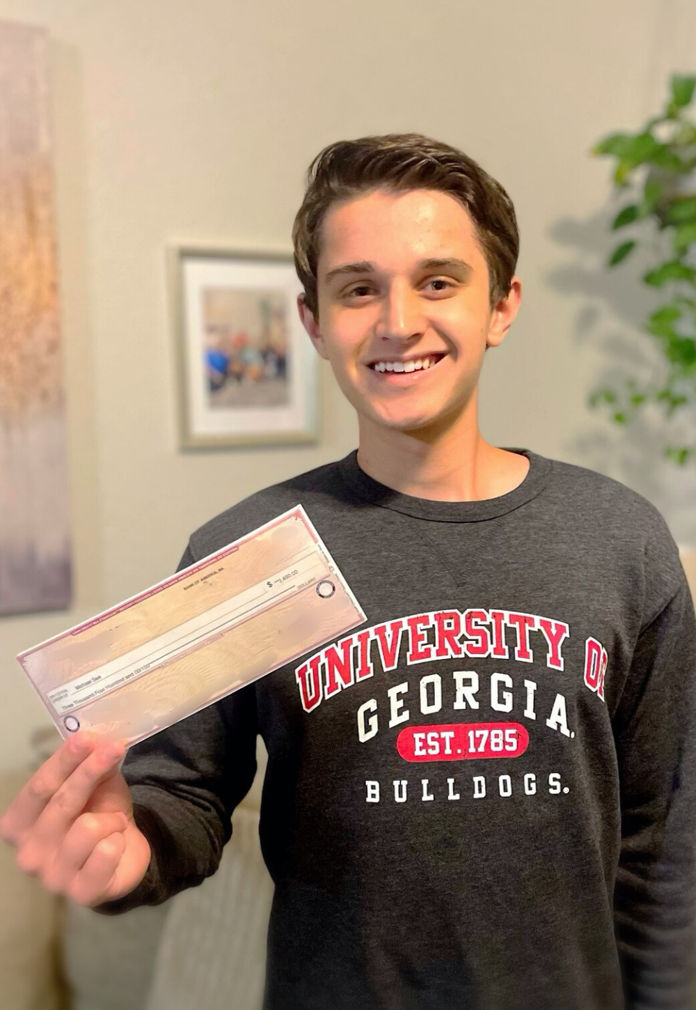 Michael See holding IT Scholarship Award check