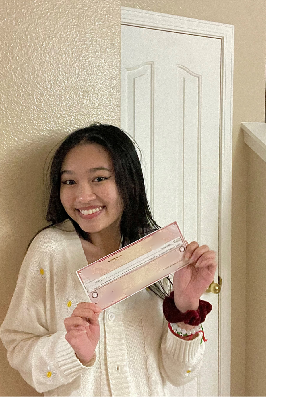 Ali Quach holding IT Scholarship Award check