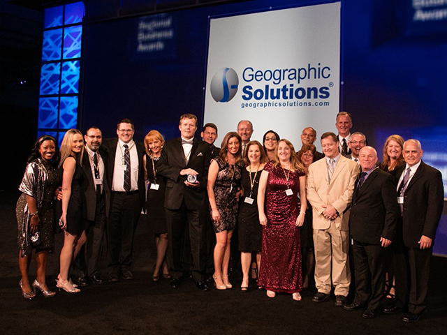 In this picture, a group of employees are accepting an award for Large Business of the Year at the 2016 Brighthouse Regional Business Awards.