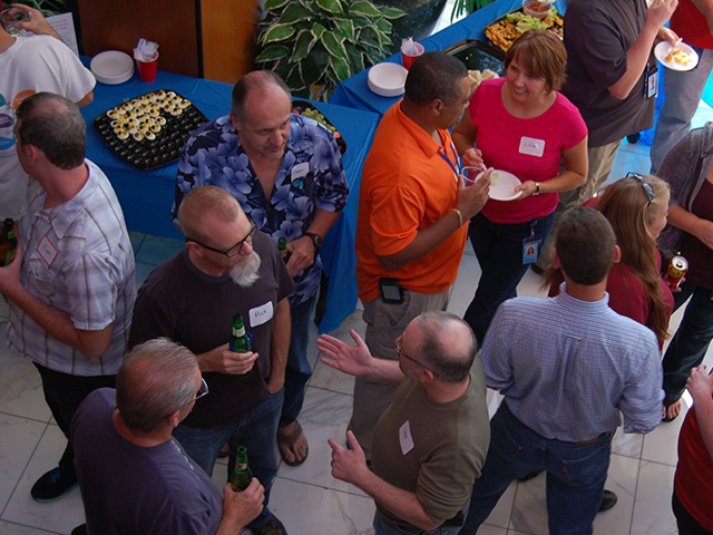In this picture, our employees are networking at our quarterly GeoSocial.