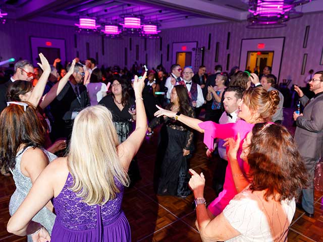 In this picture, employees blow off steam while dancing the night away at our annual holiday party.