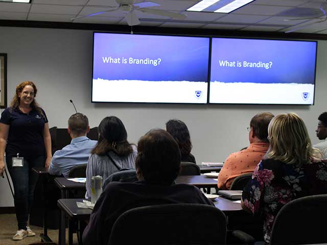 In this picture, employees connect with industry professionals to discuss relevant topics.