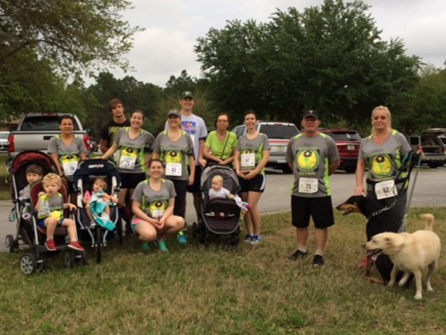 In this picture, a group of employees are posing for a picture at Elisa’s Greatest Wishes 5K