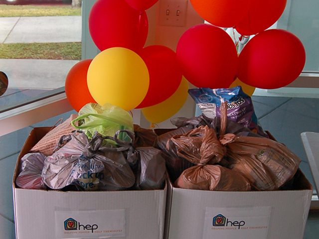 In this picture, employees have gathered donations for a local charity.