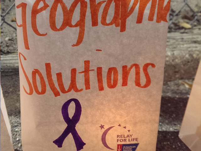 In this picture, a handwritten sign with our company name at Relay for Life.
