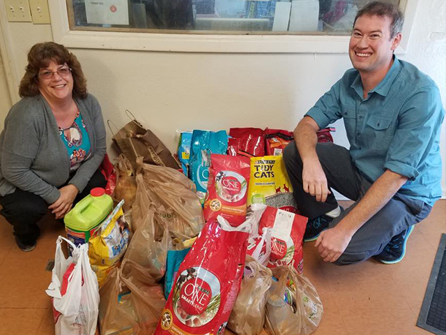 In this picture, a group of employees gathered donations for a local animal charity.