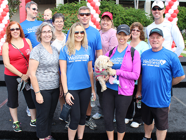 In this picture, a group of employees pose for a picture at the Tampa Bay Heart Walk.