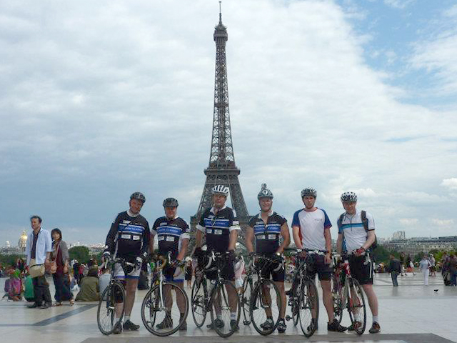 In this picture, a group of employees pose on their bikes as part of a charity bike ride across Europe.