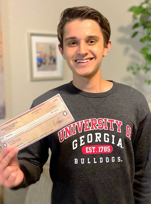 Michael See holding IT Scholarship Award check