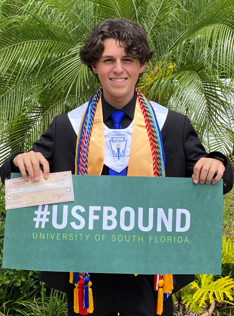 Evan Vargas holding IT Scholarship Award check